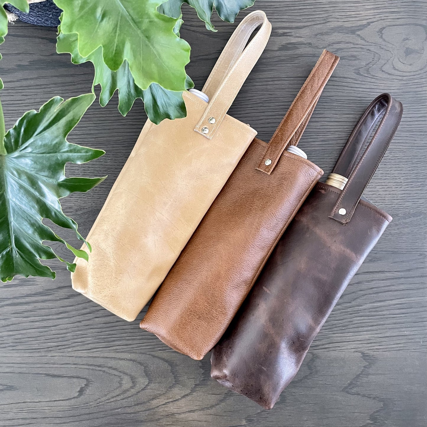 Leather wine bags in tan, toffee and chocolate leather