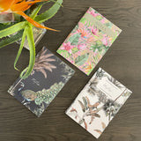 Three designer soft cover notebooks