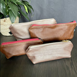 Collection of Pencil bags in Brown and Metallic Pink Leather available in large and small size