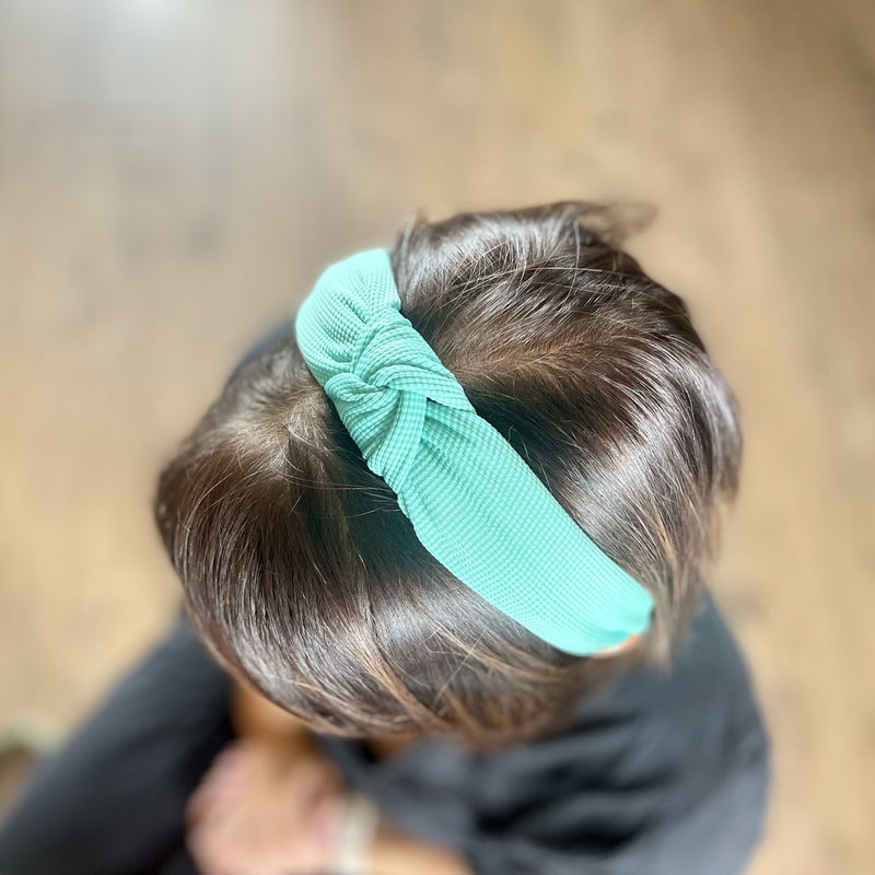 Bright Knot Alice Band in Turquoise on head