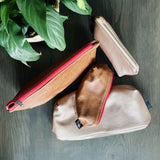 Collection of large and small pencil bags in brown and pink leather