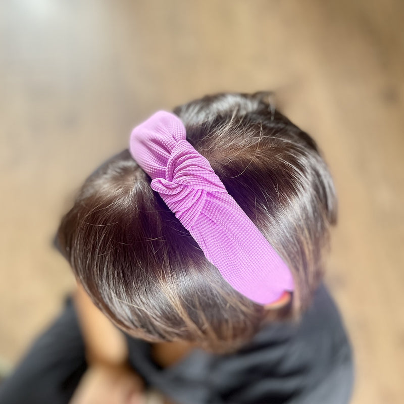 Bright Knot Alice Band in Purple on head