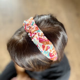 Pink Floral Knot Alice Band on head