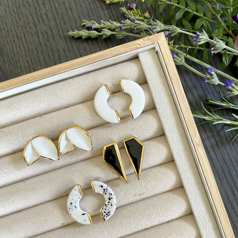Variety of white, gold and black earrings
